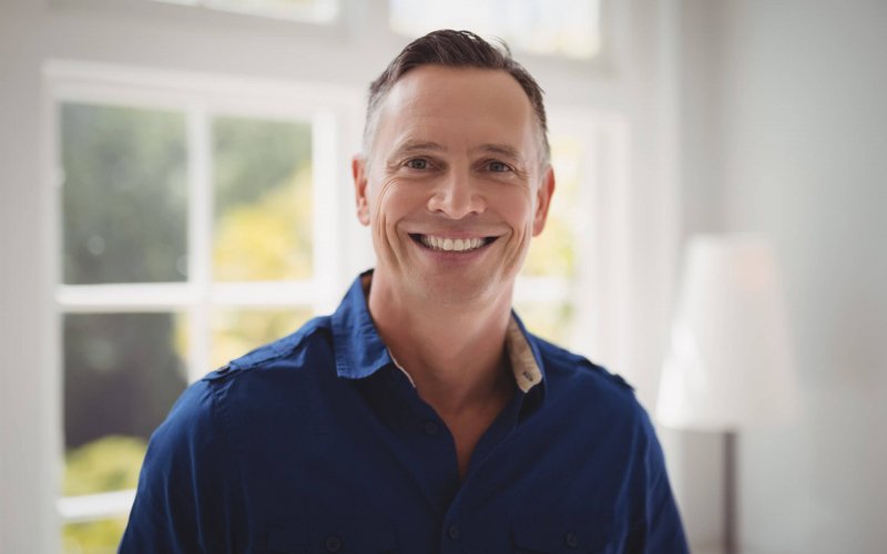 Portrait of happy man in restaurant